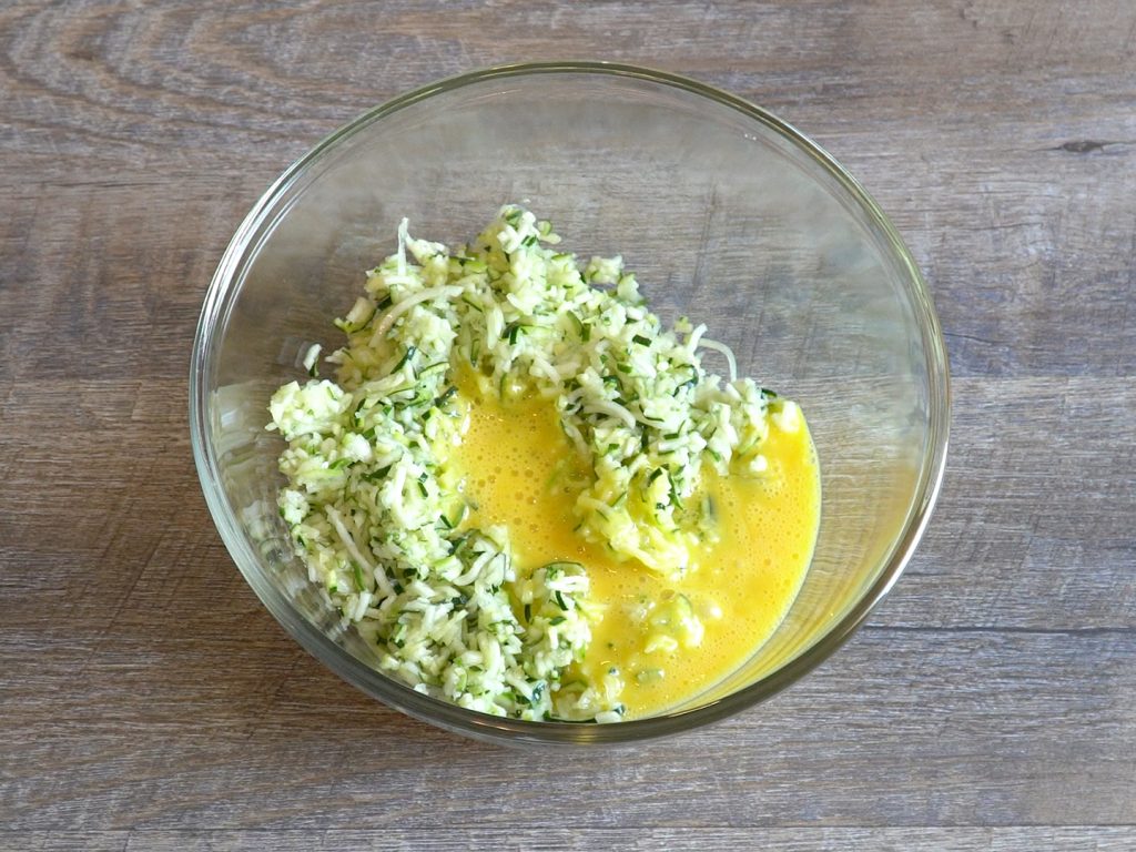 mixing ingredients for zucchini patties bariatric recipe